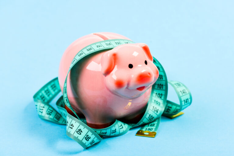 financial diet. money diet. finance and commerce. low pay. Saving money. Deposit. loan concept. Take credit. piggy bank with measurement tape. Moneybox. Economy and budget increase