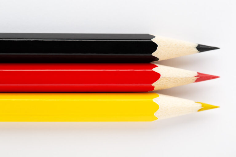 National flag made of colorful wooden pencils on white background