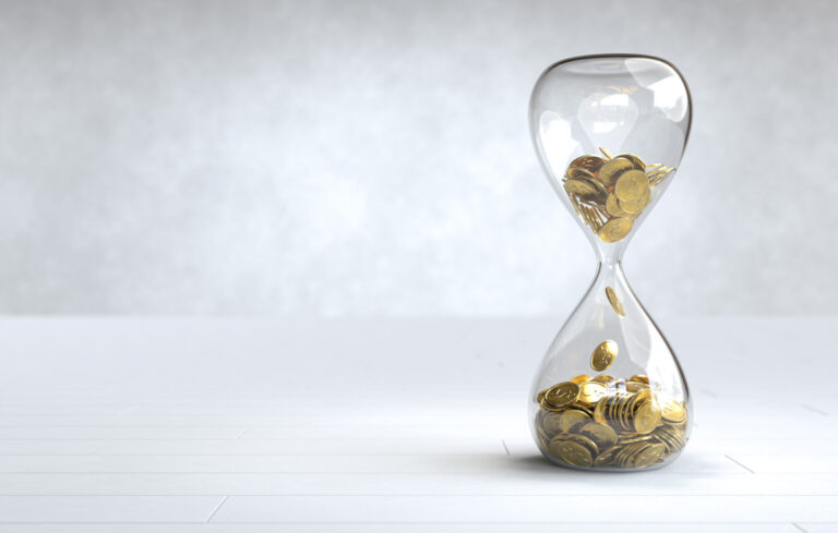 Gold coin in the hourglass, Time is money concept