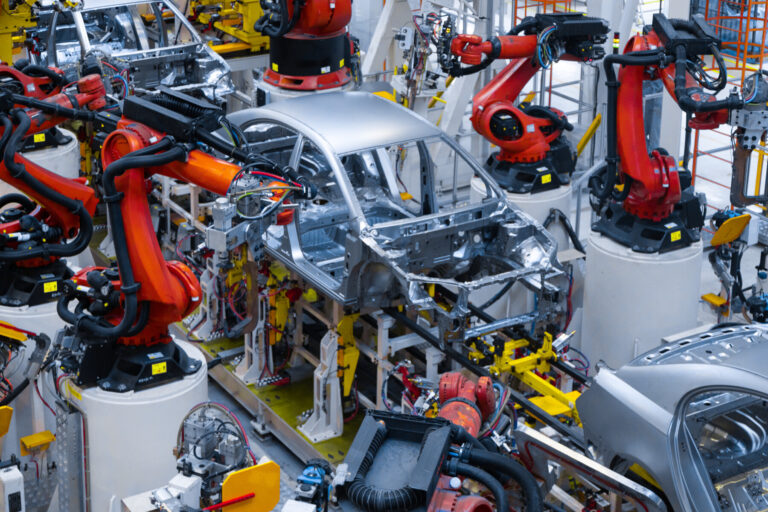 Automotive production line. welding car body. modern car assembly plant
