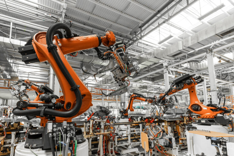 Photo of automobile production line. welding car body. modern car assembly plant. auto industry