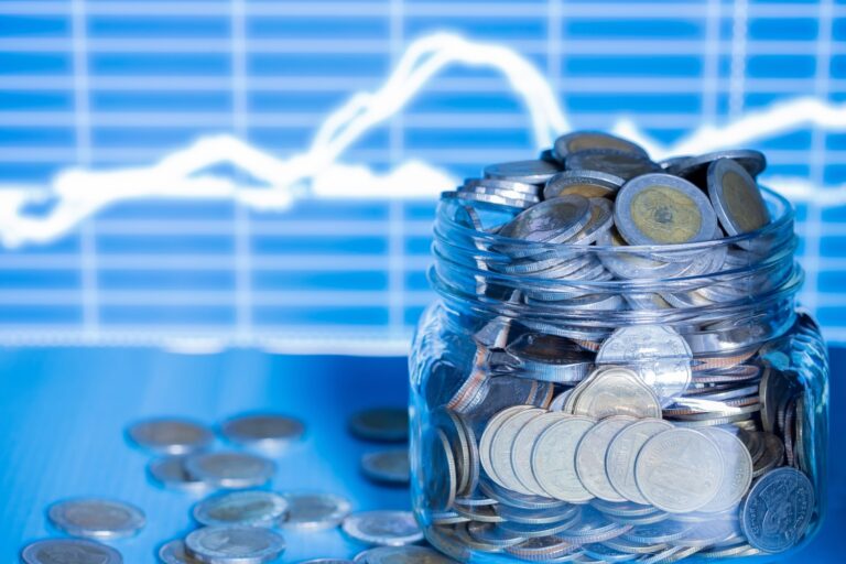 Double exporsure stacked coins night with graph