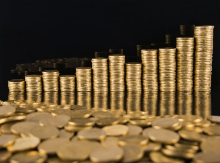 Close up coins table against black background