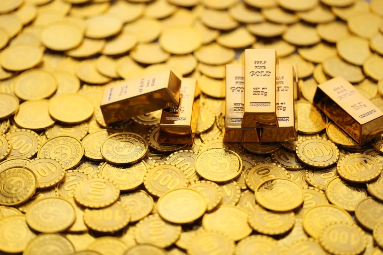 Financialgold bars with stack coins money yellow background business investment saving money prepare future concept