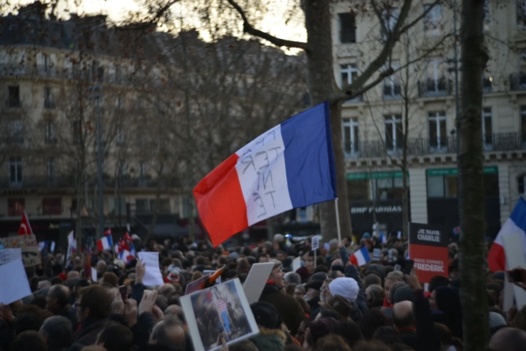 Group people street against buildings city