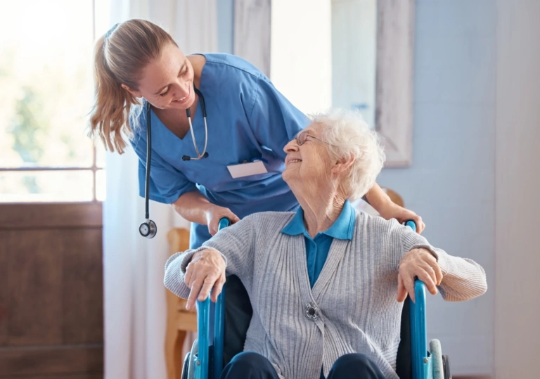 Nurse Home Elderly Woman With Disability Wheelchair Medical Nursing Facility Happy Healthcare Doctor Helping Talking Disabled Senior Lady Retirement House Australia