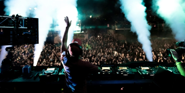 Rear View Dj Playing Music Front Excited Crowd Music Festival By Night