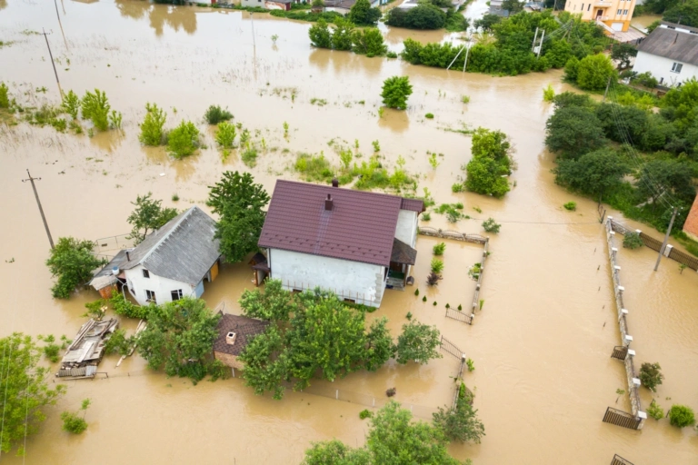 Aerial View Flooded House With Dirty Water All Around It