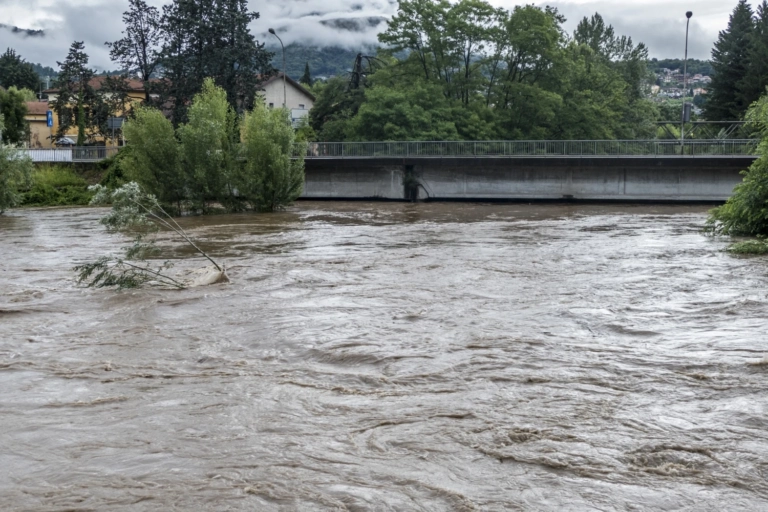 Flooded River After Storm Touches Bridge
