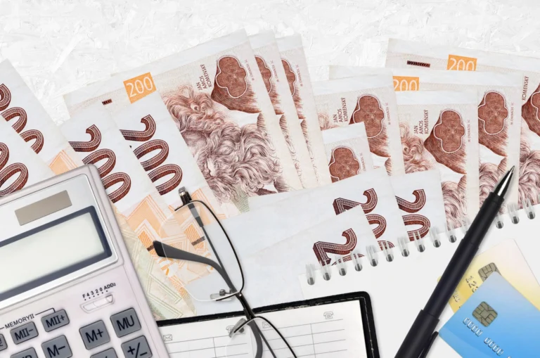 Czech korun bills calculator with glasses pen