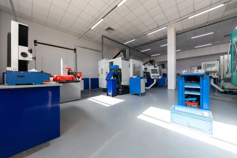 Close up shot screw cutting machine factory that makes metal details