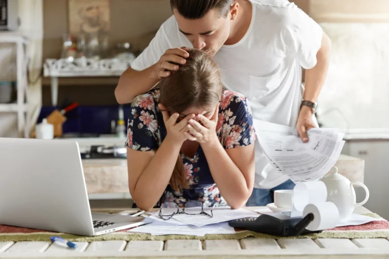 Couple managing budget together kitchen