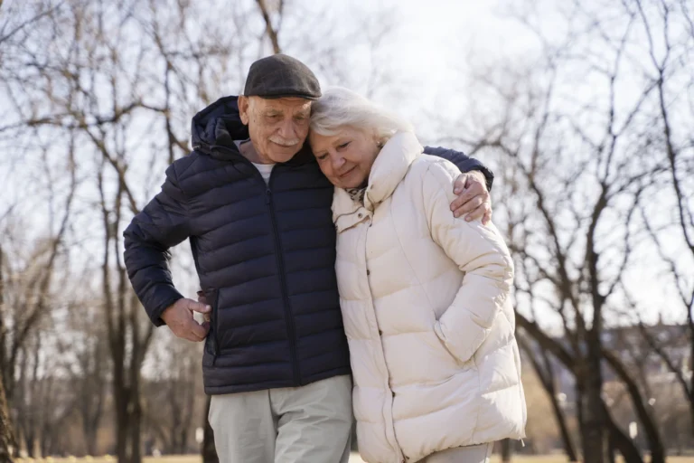 Medium shot senior couple walking together
