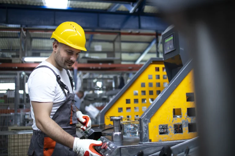 Portrait factory worker working industrial machine production plant