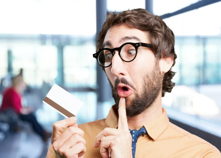 Crazy man with credit card funny expression